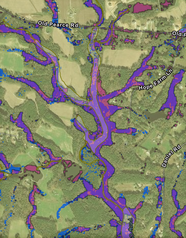 Example area showing greater prediction of wetlands with MaxEnt models than mapped by NWI (Complete model = blue; minimal model = pink, NWI = light yellow)
